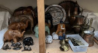 Far eastern copper pots and chargers together with horse brasses, carved and porcelain elephants,