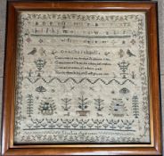 A 19th century sampler embroidered with the alphabet, a verse, birds, trees and insects, "Ellen Lee,