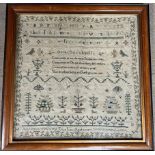 A 19th century sampler embroidered with the alphabet, a verse, birds, trees and insects, "Ellen Lee,