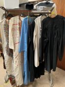 A Ralston large gown together with other gowns and graduation cap and gowns