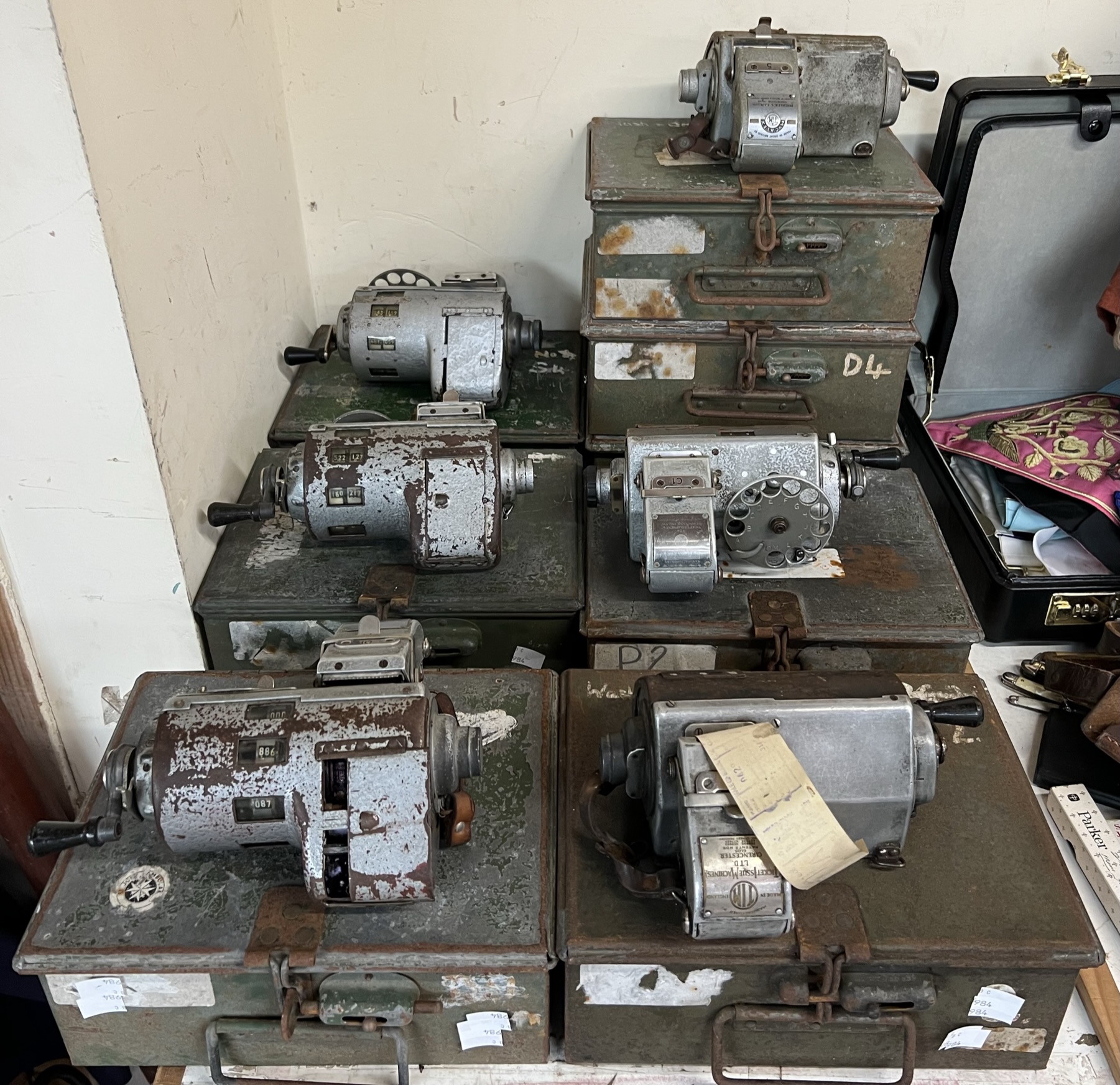 A Plessey ticket machine together with a large collection of ticket machines in their original