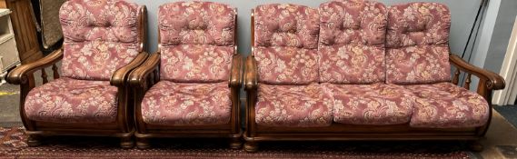 An oak framed upholstered three piece suite