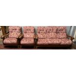 An oak framed upholstered three piece suite