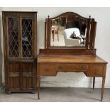 An Edwardian mahogany dressing table with three mirrors above three drawers on square tapering legs