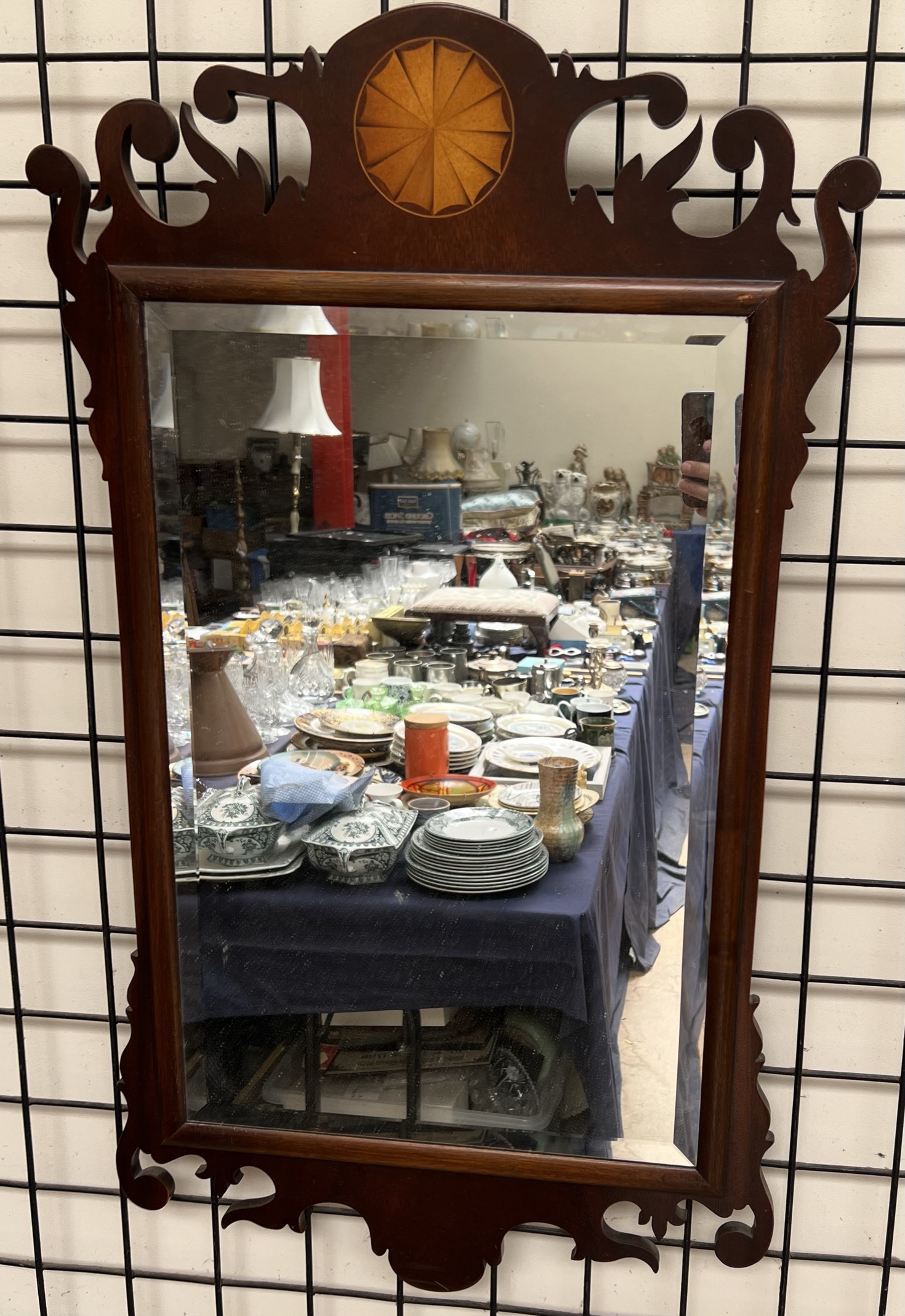 A George III style mahogany wall mirror with fan inlay