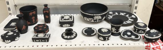 A collection of Wedgwood black basalt wares, including vases,