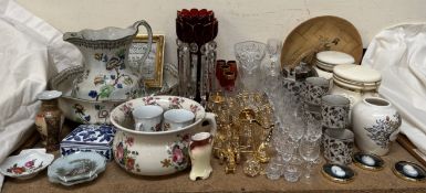 A pair of cranberry glass table lustres together with drinking glasses,