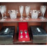 A set of eight Royal Doulton crystal champagne glasses together with a pair of Royal Doulton ice