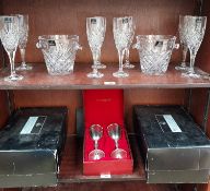 A set of eight Royal Doulton crystal champagne glasses together with a pair of Royal Doulton ice