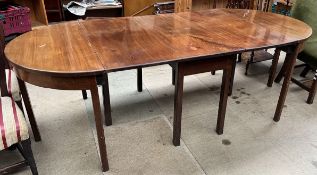 A George III mahogany gateleg dining table together with two D end tables