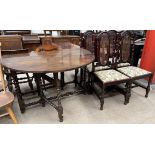 A 19th century gateleg table with an oval top and drop flaps on barley twist legs together with a