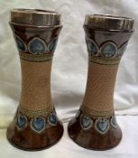 A pair of Royal Doulton silver topped vases of waisted form decorated with hearts