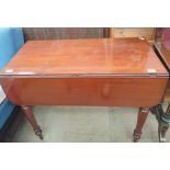 A Victorian mahogany Pembroke table with drop flaps on turned legs ***PLEASE NOTE THAT THIS LOT