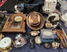 A carved mantle clock together with a brass cased barometer, electroplated wares, wooden bowls,