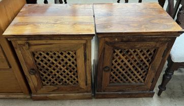 A pair of hardwood side cabinets with rectangular top above slatted doors on a plinth