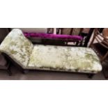 An Edwardian upholstered chaise longue with turned legs