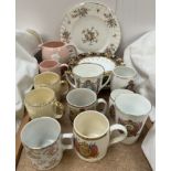 Assorted decorative plates, together with Royal commemorative mugs,