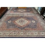 A pair of modern rugs with a central floral medallion and multiple flower heads,