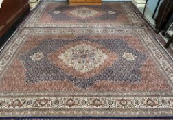 A pair of modern rugs with a central floral medallion and multiple flower heads,