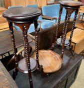 A pair of hardwood torcheres, approximately 80cm high,