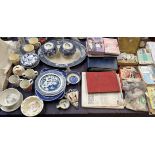 A large collection of cigarette cards, loose and in albums together with blue and white pottery,