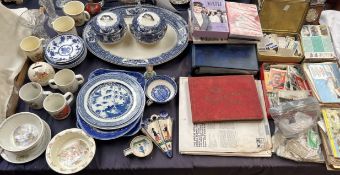 A large collection of cigarette cards, loose and in albums together with blue and white pottery,