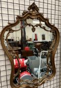 A modern gilt decorated wall mirror