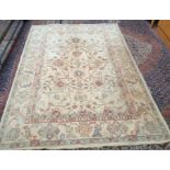 A modern cream ground rug with interlaced flowers