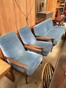 A mid-20th century teak three piece suite with reclining chairs and sofa bed CONDITION