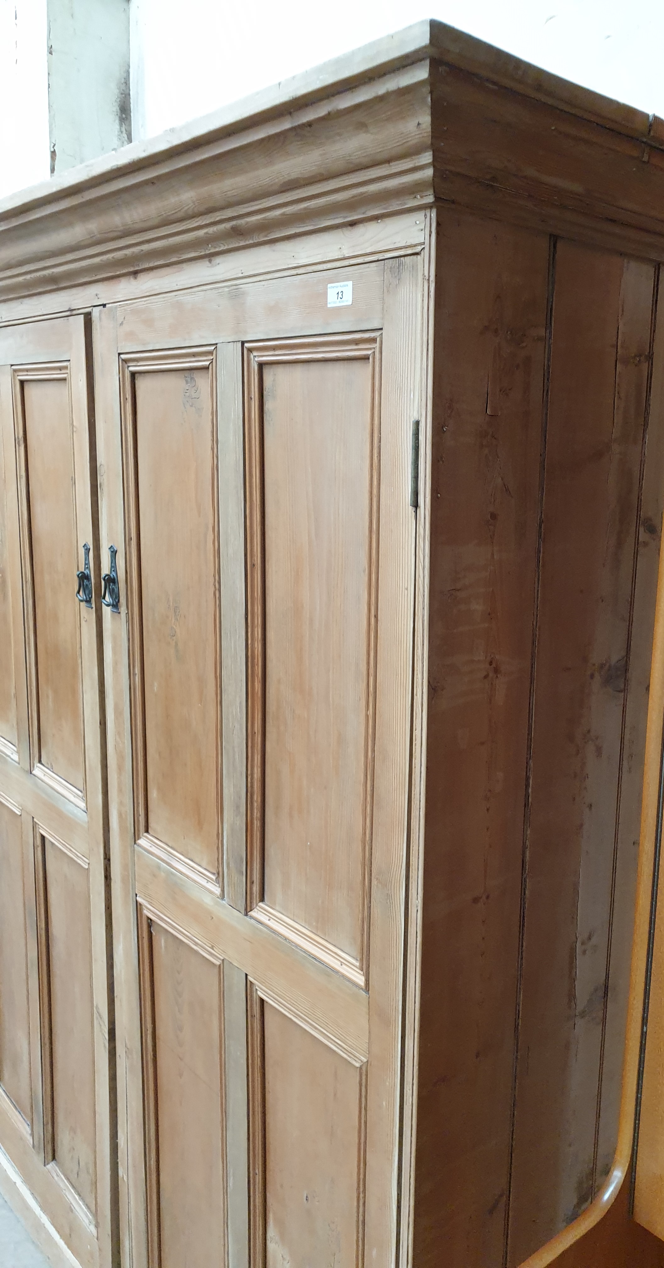 A large pine side cabinet with a moulded cornice above a pair of panelled cupboard doors on a - Image 4 of 6