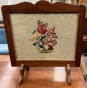 A mahogany framed fire screen with an embroidered panel of a squirrel and flowers ***PLEASE NOTE