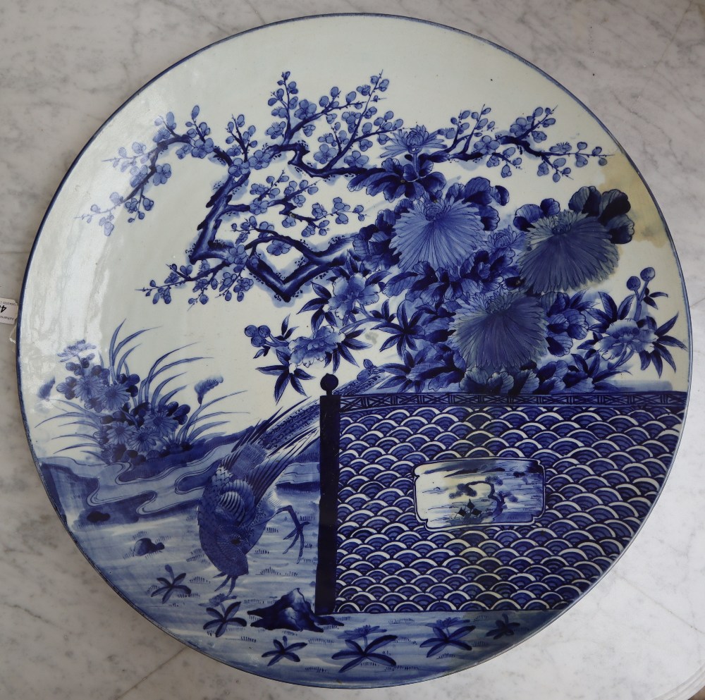 A large Japanese charger, decorated with a bird of paradise in a landscape, 61.