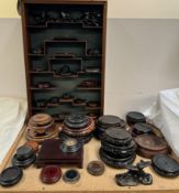 A Chinese hardwood wall mounted display cabinet together with a collection of Oriental carved