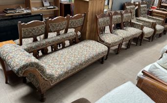 An Edwardian nine piece salon suite comprising a chaise longue,