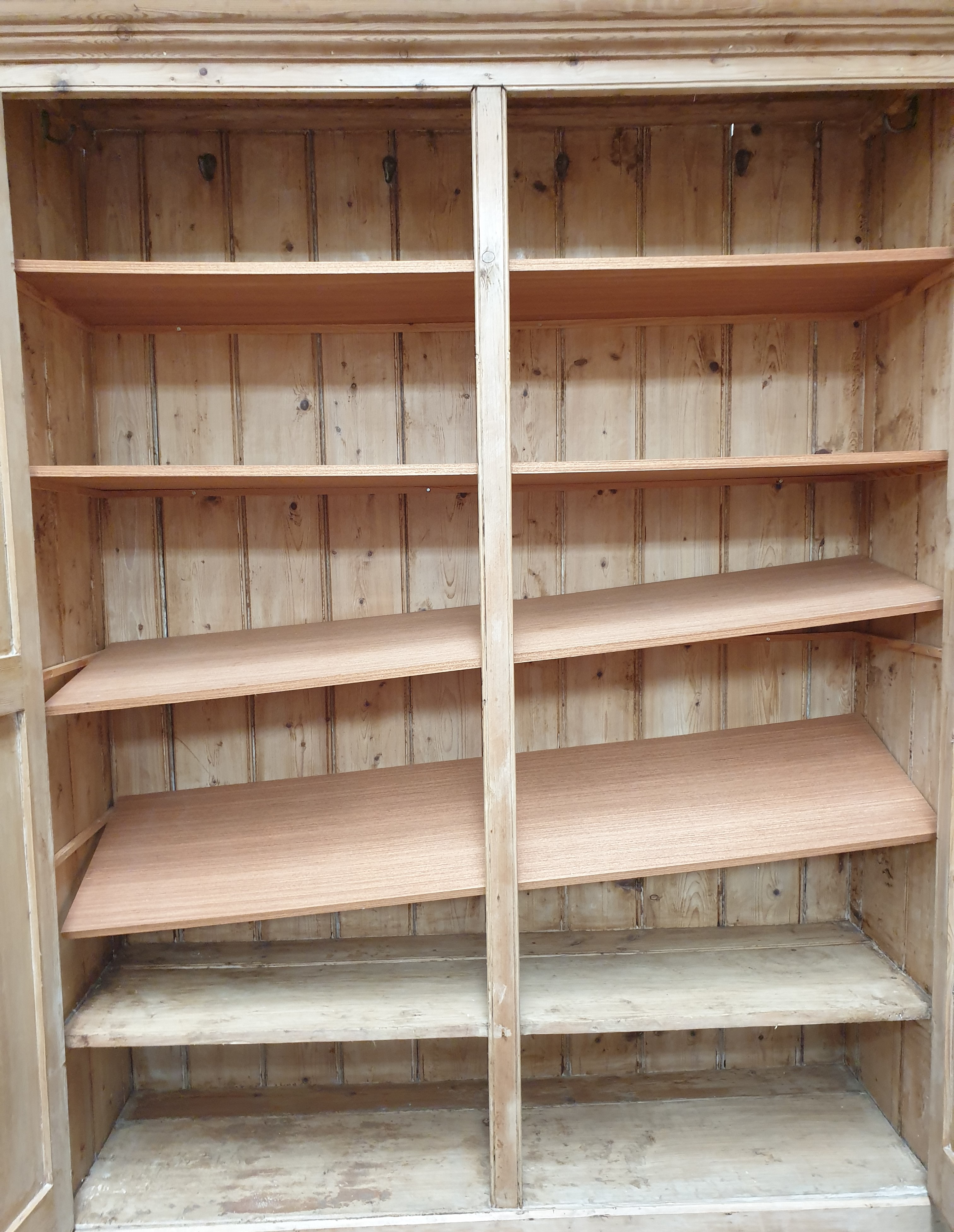 A large pine side cabinet with a moulded cornice above a pair of panelled cupboard doors on a - Image 2 of 6