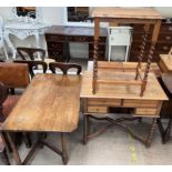 An oak gateleg dining table together with an oak desk and an oak occasional table