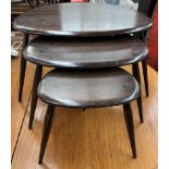An Ercol pebble nest of three tables