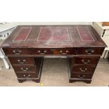 A reproduction mahogany pedestal desk,