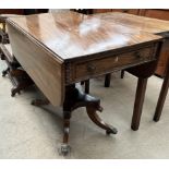 A Regency mahogany Breakfast table with drop flaps and a frieze drawer on a turned pedestal and