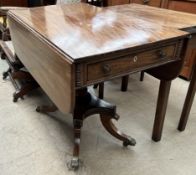 A Regency mahogany Breakfast table with drop flaps and a frieze drawer on a turned pedestal and