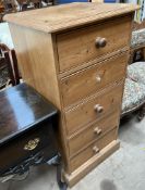 A pine four drawer chest on a plinth base