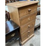 A pine four drawer chest on a plinth base