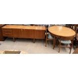 A McIntosh teak sideboard together with a dining table and four chairs