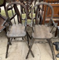 A pair of spindle back child's high chairs