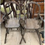 A pair of spindle back child's high chairs