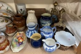 A Belleek porcelain vase together with A Doulton Lambeth jar and cover, various jugs,