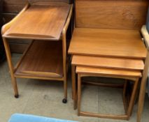 A teak tea trolley together with a teak nest of tables