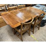 A 20th century oak extending dining table and four chairs