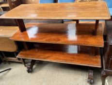 A Victorian mahogany three tier telescopic buffet on carved feet