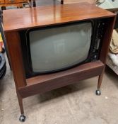 A Dynatron CTV29 televison contained within a tambour fronted case - Sold As Seen,